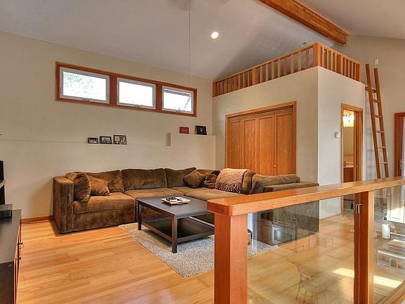 Upper level living room. Loft above bath room and closet