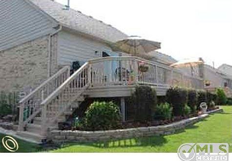 rear of condo with new deck
