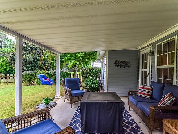 large covered patio / fenced private backyard