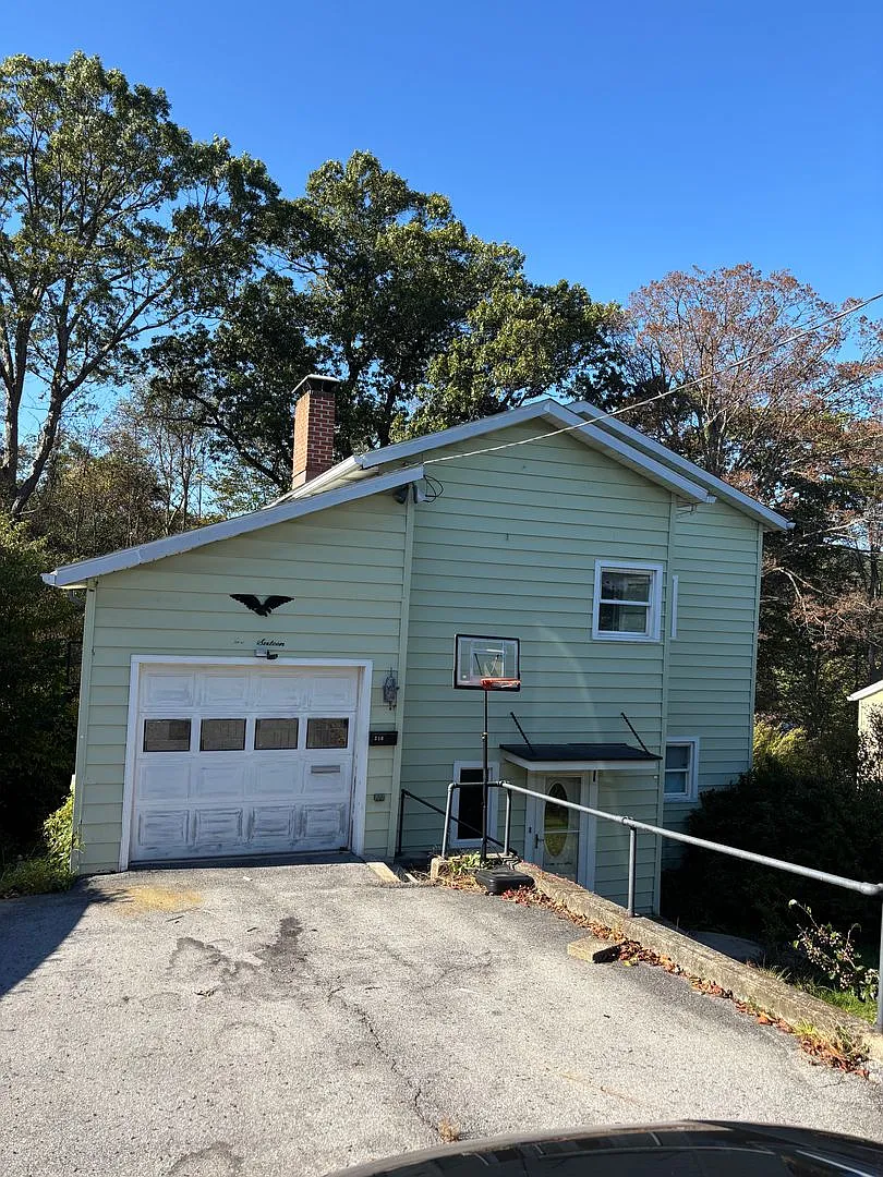 Charming 2-Bedroom Single-Family Home with Garage and Off-Street Parking — Photo 1
