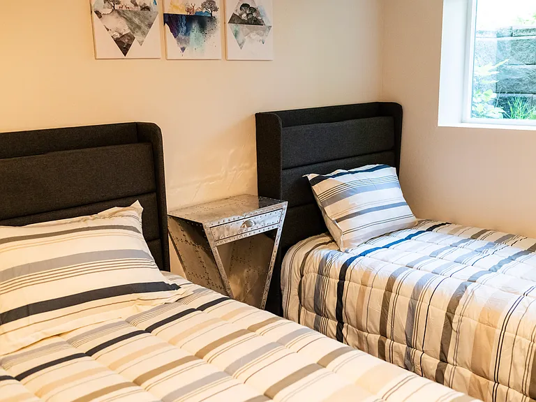 2 Twin Beds which include sheets and pillows