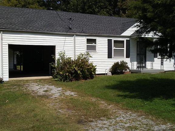Front view showing breezeway/carport