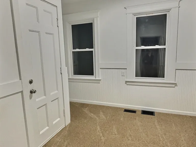 second bedroom with fresh paint and brand new carpet