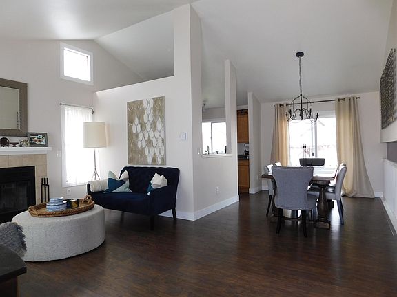 Open floorplan between living room, dining room and kitchen. New paint, doors, baseboards/trim and windows throughout the house.