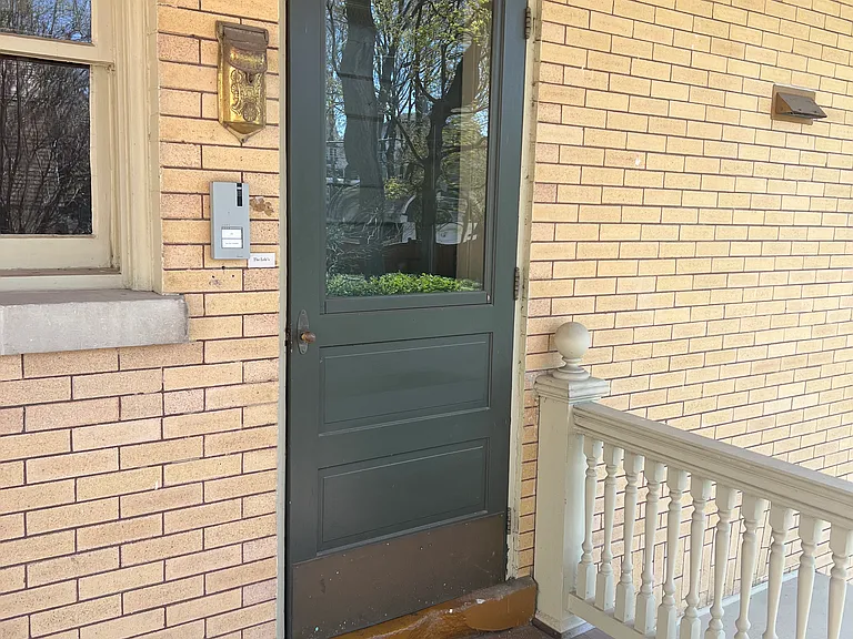 Back Door Entry to Mud Room and Apartment Entry Door