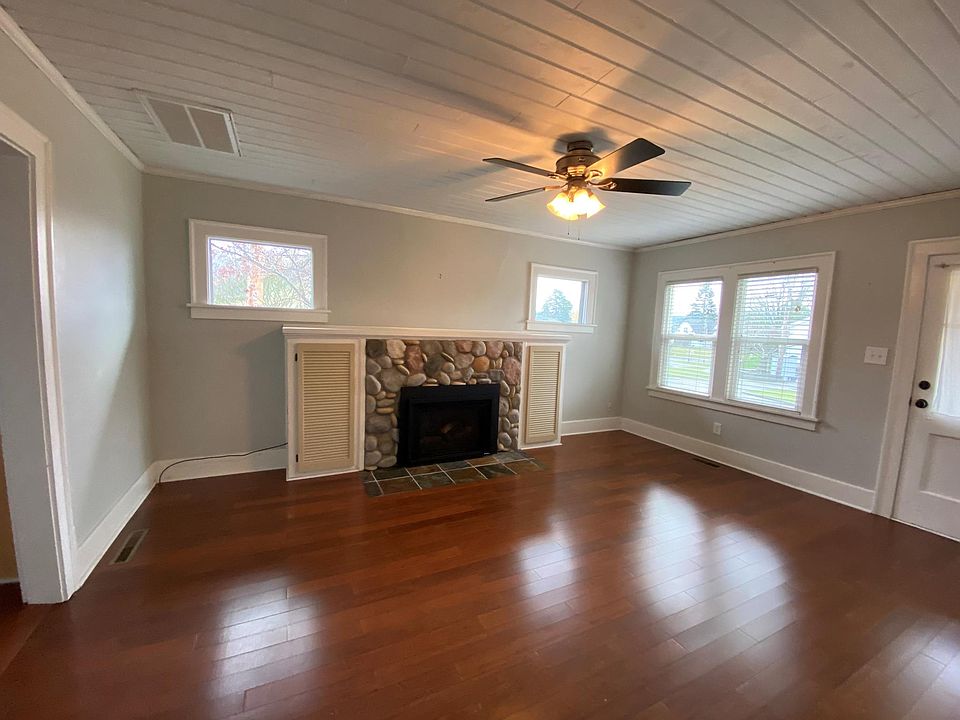 Living Room with gas fireplace and wood floors