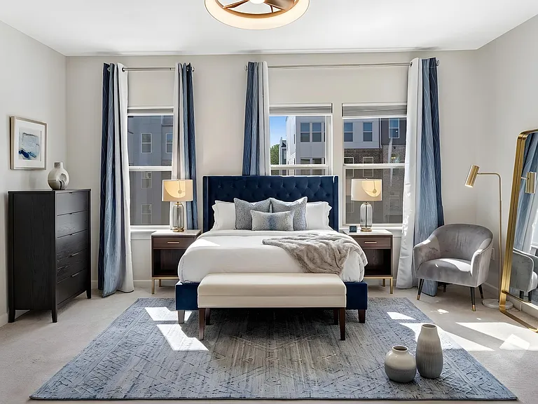 Generously sized primary bedroom designed for comfort, relaxation, and privacy. Virtually staged.