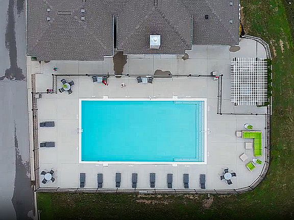 From above: the full picture of your outdoor space, complete with pool, lounge, grill, and room to unwind.