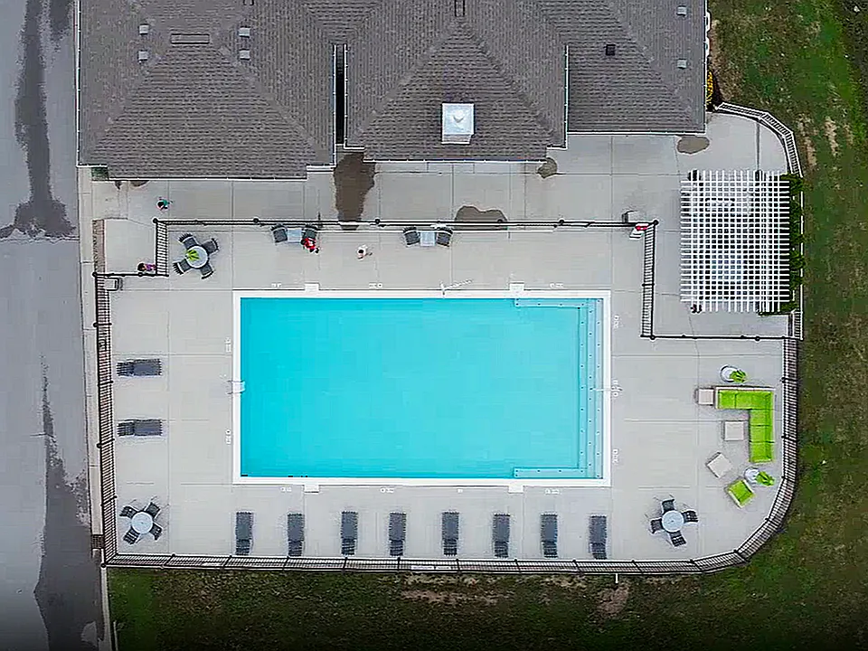 From above: the full picture of your outdoor space, complete with pool, lounge, grill, and room to unwind.