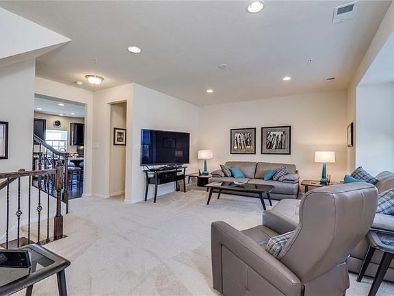Front entry is on main level. Fabulous floor plan and neutral decor are throughout the townhouse.
