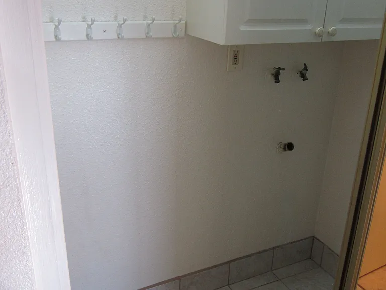 Laundry area to right as you walk down hall.
