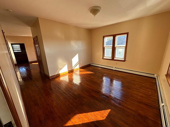 living room and hallway to other side of house