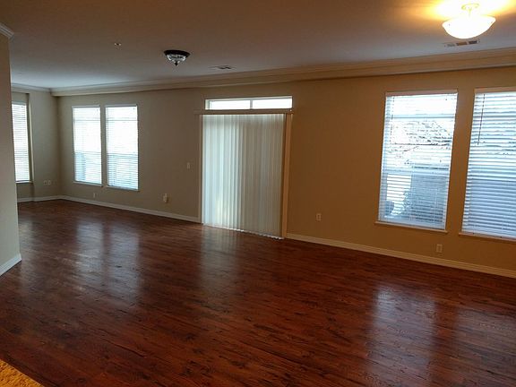 large living room with hardwood floors