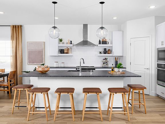 Kitchen with pendant lighting and white subway tile backsplash