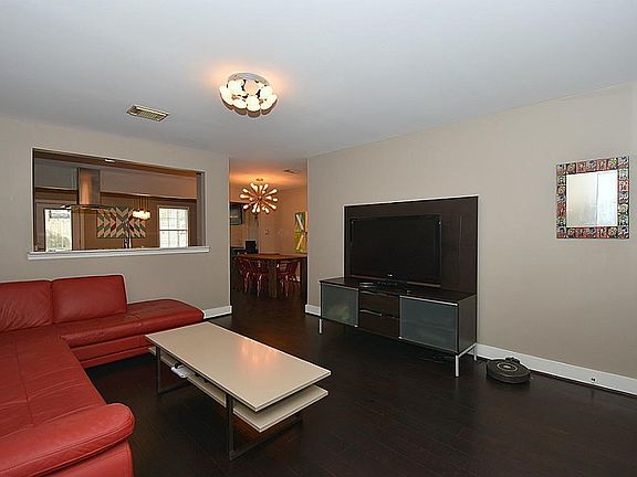 Elegant hardwood floors throughout and open concept to kitchen and back living space.