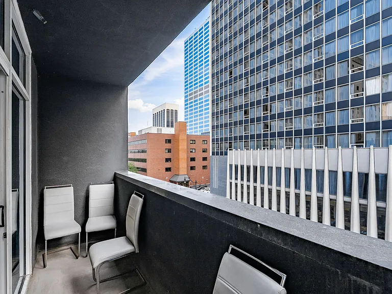 Large balcony with city views.