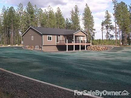 Back Of Home : Enjoy your property from this large covered deck