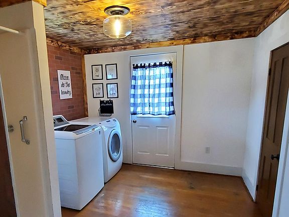 Main Floor Laundry and Large Storage Area - off the Kitchen. Full size washer and dryer, door to deck