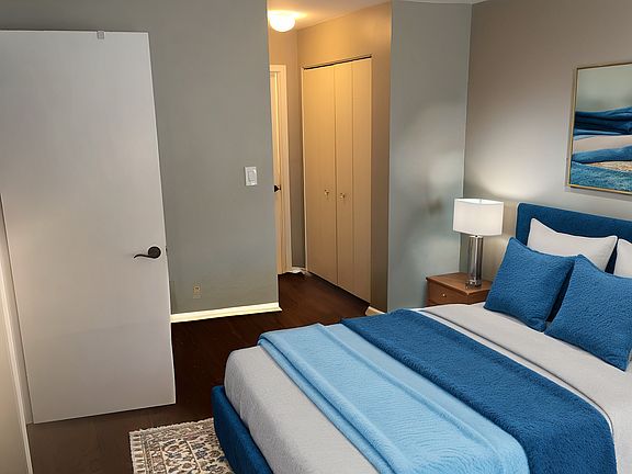 Primary bedroom with walk through double closet to en suite primary bathroom.