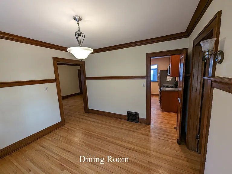 Dining room looking east. Living room to the north on the left and kitchen straight east and south 1st bedroom to right