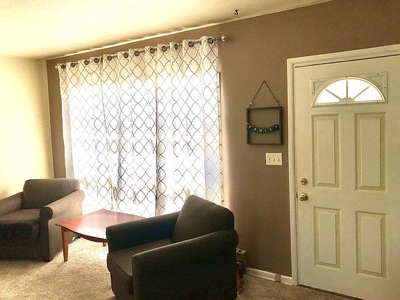 Freshly painted accent walls in Living Room, Dining Room, and Kitchen
