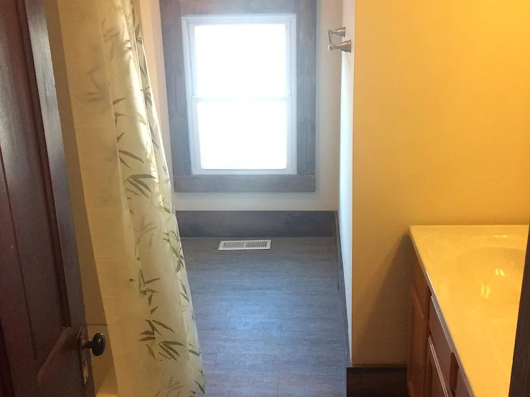 upstairs bathroom, it has double vanity sinks, tub shower & toliet