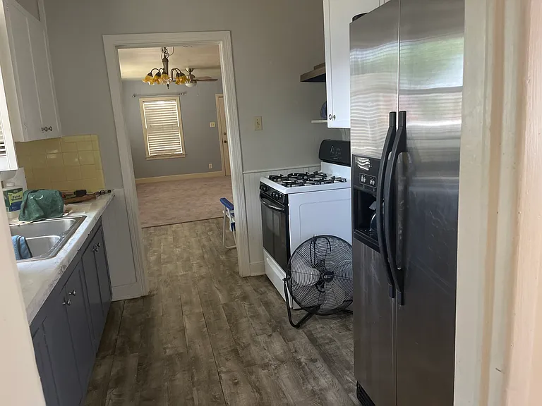 kitchen with gas range and refrigerator