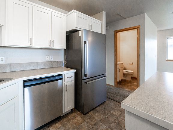 Kitchen looking into half bath