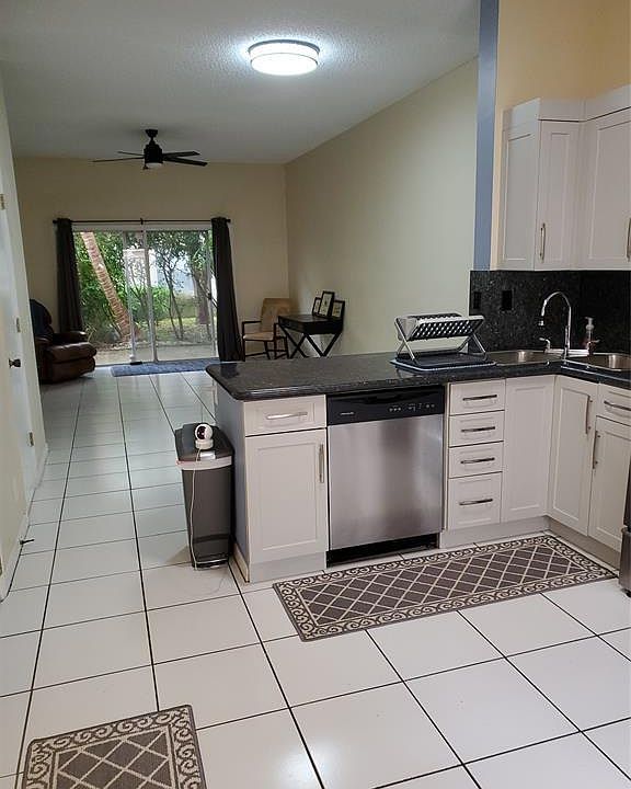 Freshly pained light grey everywhere with white trim.