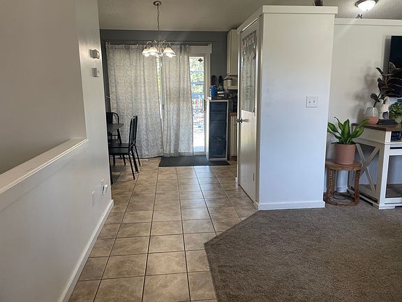 From front door to living room on right, stairs on left, dining, kitchen and pantry ahead
