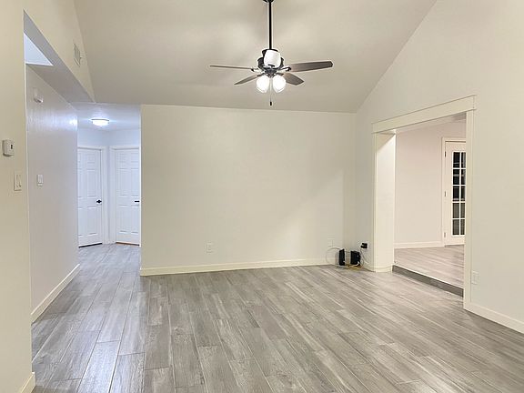 Living room showing entrance to bedrooms and TV Room