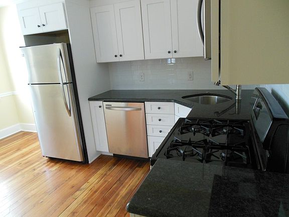 granite and tile added to refinished wood floors