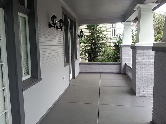 Large wide concrete front porch
