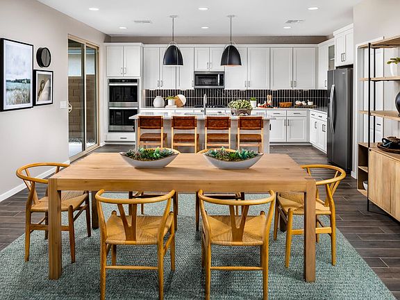 This image shows the dining and kitchen in the Ponderosa Model Home.