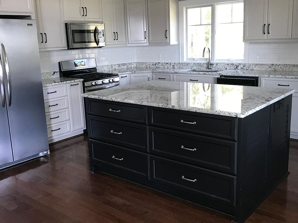 Large kitchen with all appliances, self closing custom cabinets, great lighting, large island, large kitchen sink, lots of great storage.