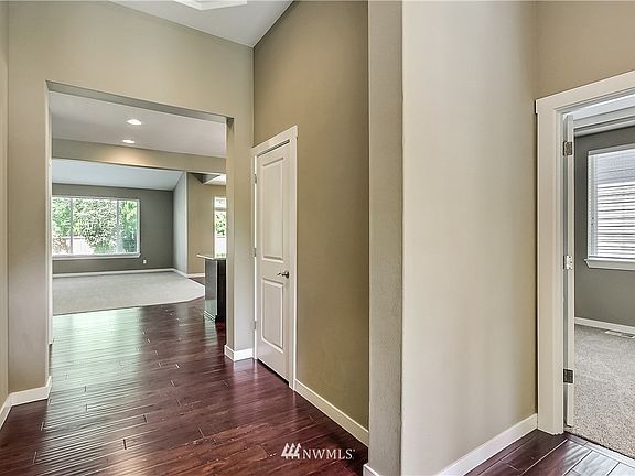 View from entry, office/bedroom to your right, coat closet and kitchen/family room straight ahead. 