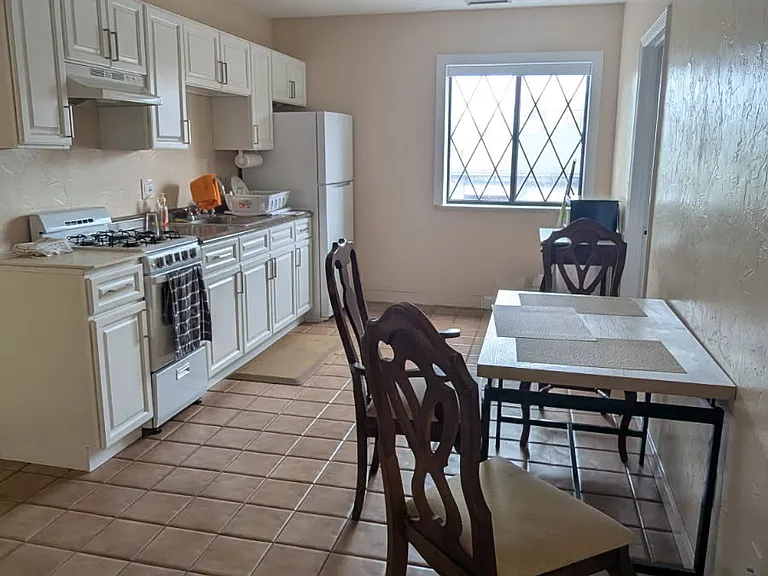 Kitchen for 1 bedroom unit, which comes with kitchen table, full size bedroom furniture, and armoire.
