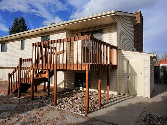 backyard deck, patio & storage shed below 