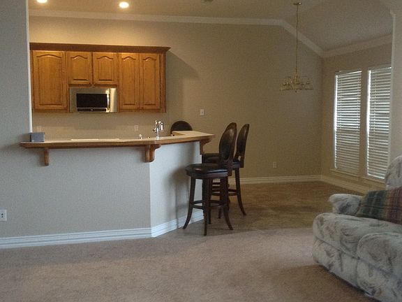 Open Floor Plan with extra bar seating around kitchen