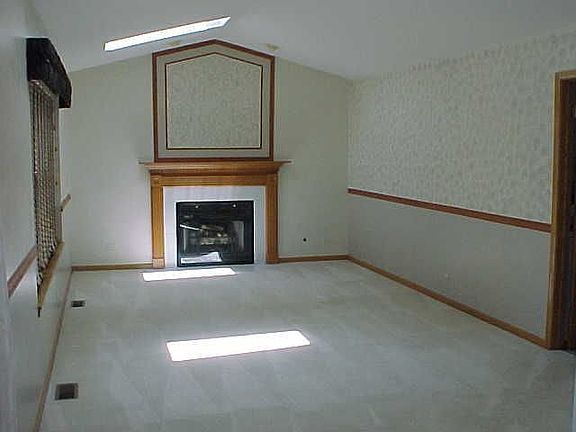 Family Room With Vaulted Ceiling and Skylights