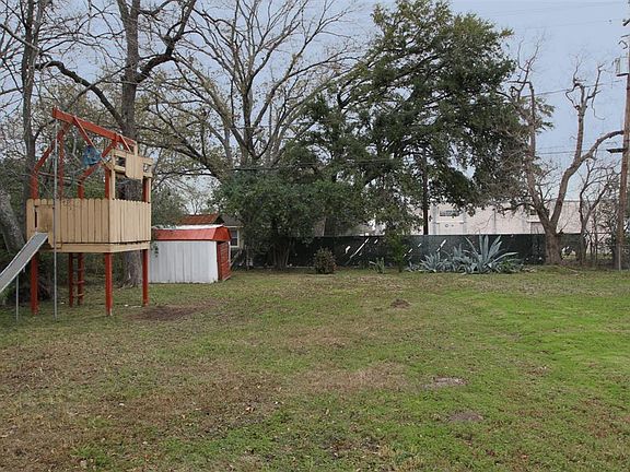 Huge yard, surrounded by trees, is perfect for the kids! And no rear neighbors