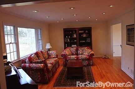 Living Room
						:
						Hardwood floors, open floor plan leads to dining room
