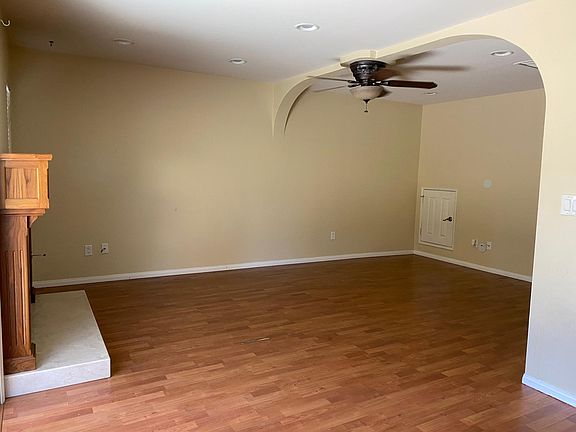 Dining area looking into living room and door to play space.