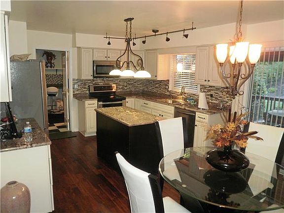 Granite counters, island, glass tile backsplash