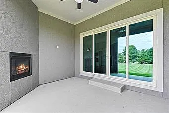 covered patio with fireplace
