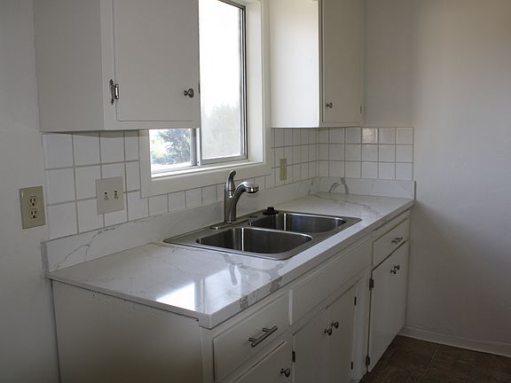 Quartz countertops, new stainless sink, faucet, range.
