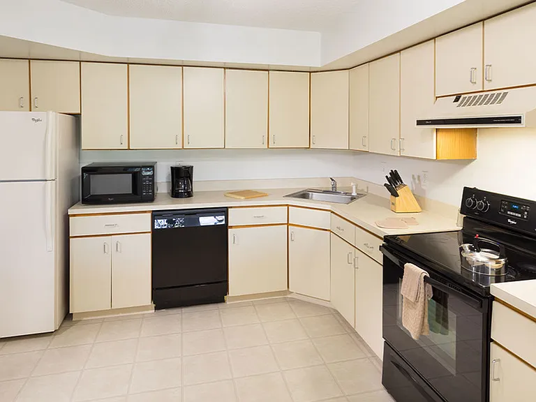 Spacious kitchen with upgraded appliances and ample cabinet and counter space
