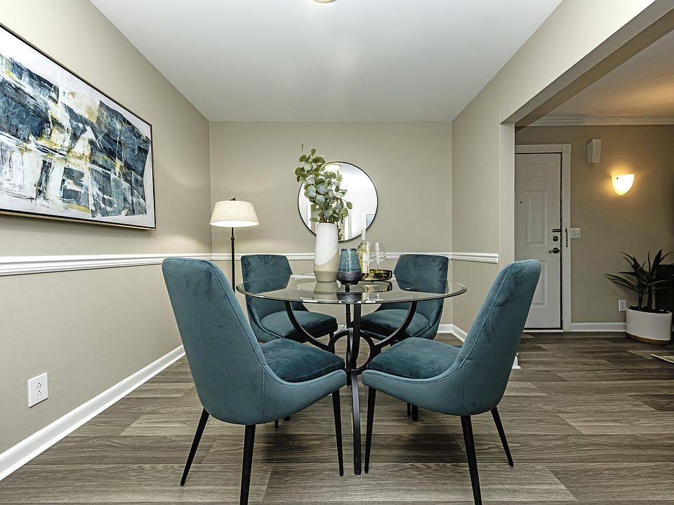 Dining area with built in lighting and wood inspired flooring