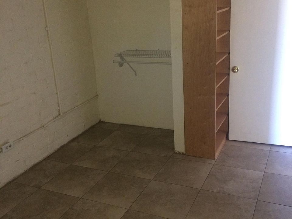 bedroom with closet and bookshelf