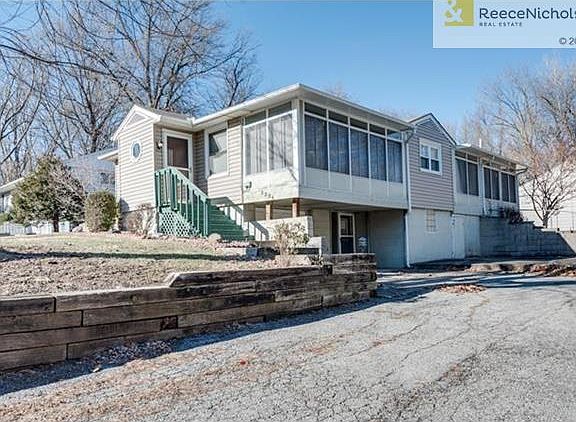 Side View with separate entrance to basement if desired.